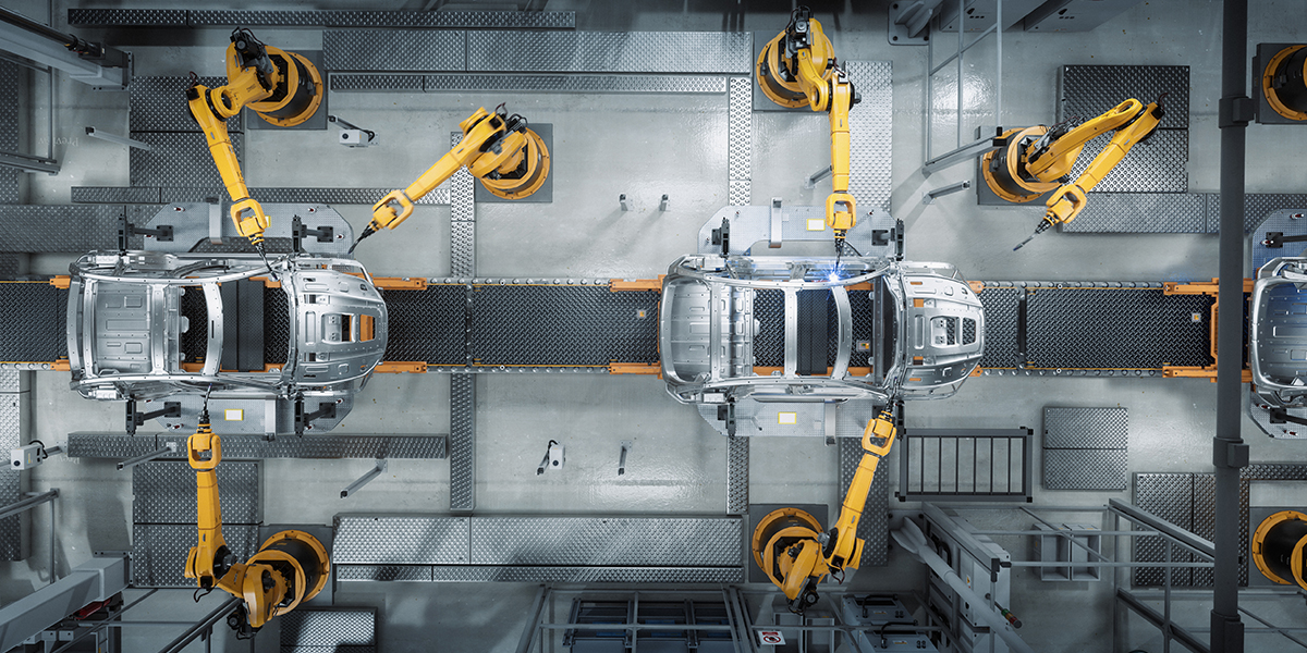 KI generiert: Das Bild zeigt eine Produktionslinie mit mehreren Industrierobotern, die an der Konstruktion von Autokarosserien arbeiten. Der Hauptinhalt ist die Automatisierung in einer Fertigungsumgebung.